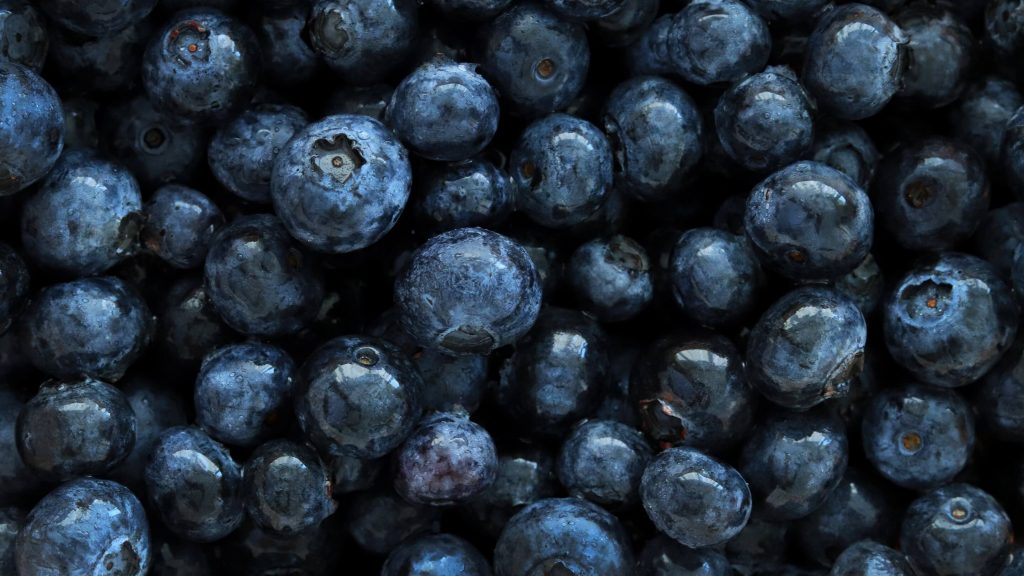 An up-close photo of several blueberries