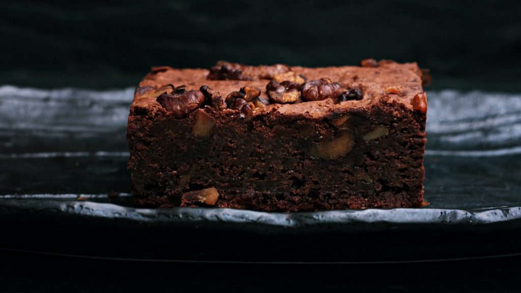 A mouthwatering walnut brownie, rich in chocolatey goodness.